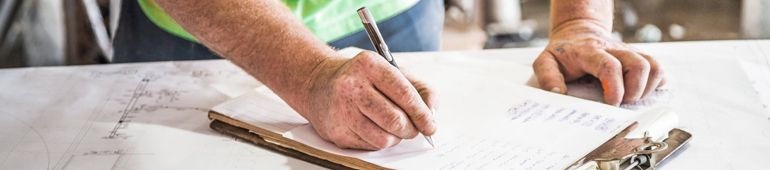 Man Signing a Construction Contract